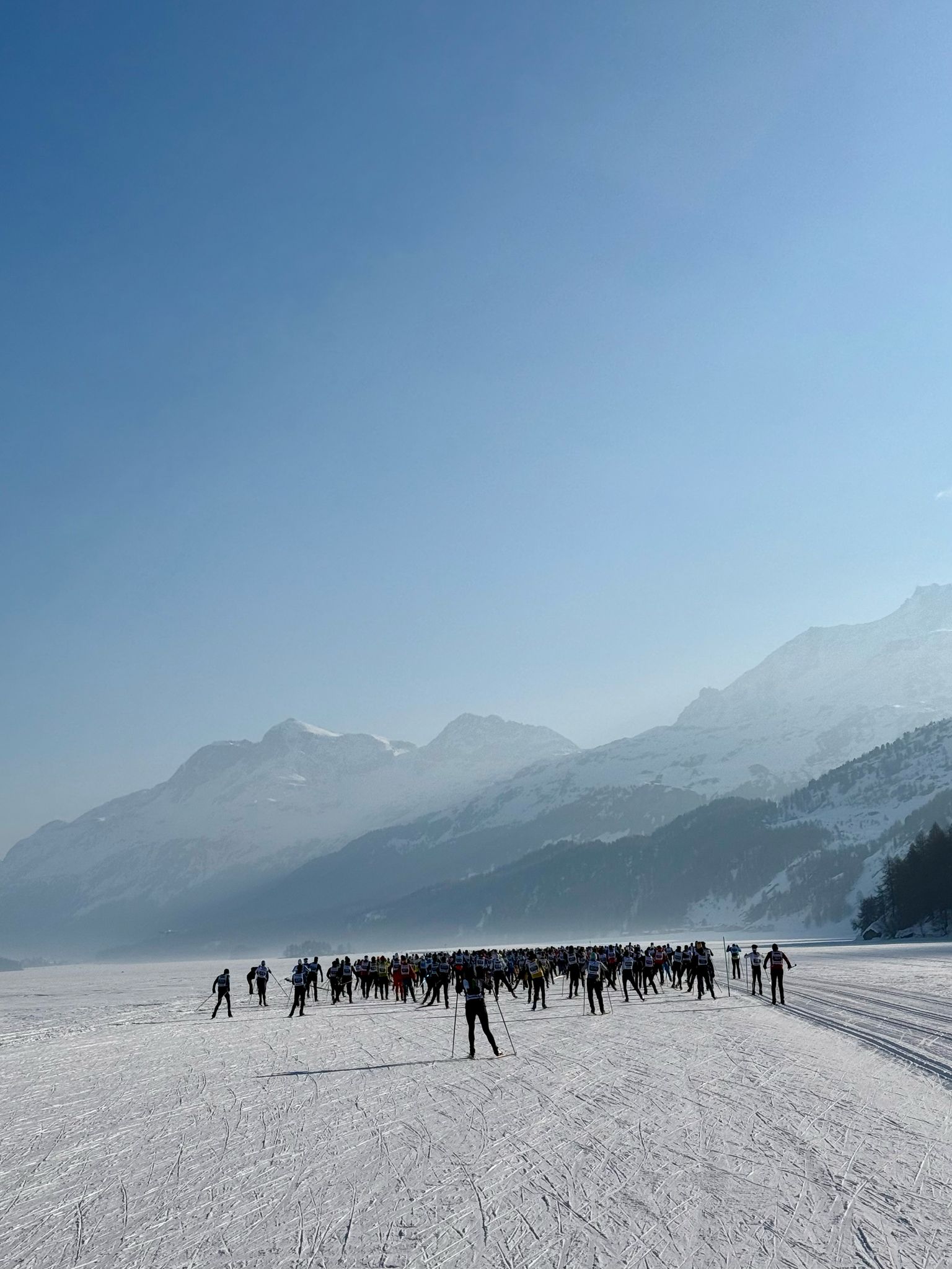 Naomi cross-country skiing in winter sunlight.